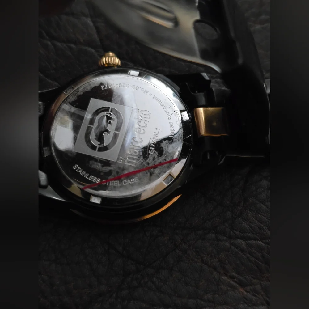 Marc Ecko womens E17536L1 black and gold‎ with gem accents. Stainless steel